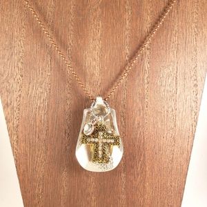 Spoon with cross necklace